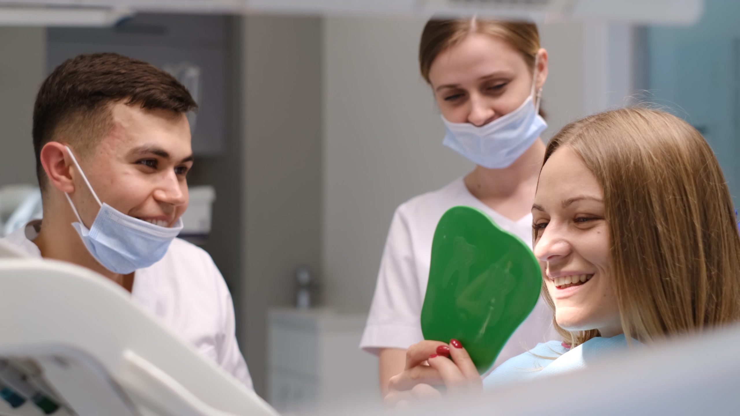 A smiling patient receiving a dental implant consultation at Implant & Cosmetic Dentistry of Northern Indiana in New Haven, IN; phone 360-800-2013.