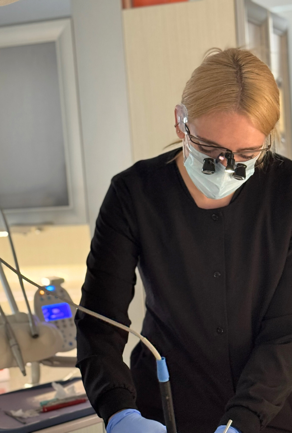 A team member at new haven dental center caring for a patient