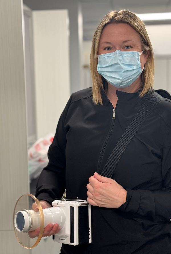 Dental team member taking xrays